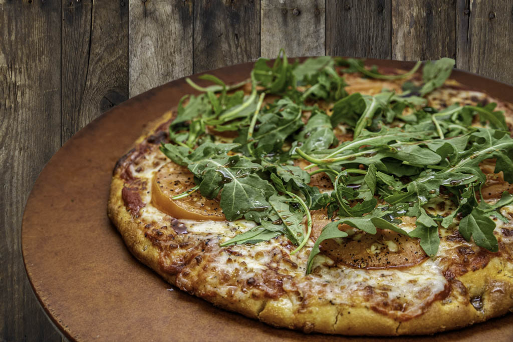 Fresh Mozzarella, Tomato, Arugula, Cracked Pepper, Olive Oil, and Balsamic Reduction Drizzle on our Zesty Red Sauce or Pesto